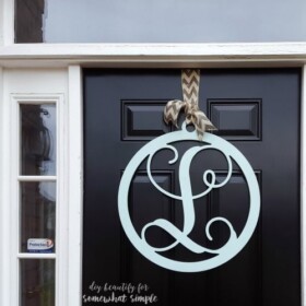 Spray paint a brand new item to make it work for your home, like I did with this monogram door hanger!