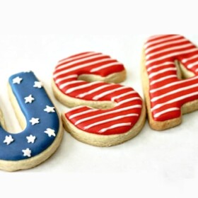 Three sugar cookies that spell out USA and decorated with patriotic colors are perfect for the 4th of July