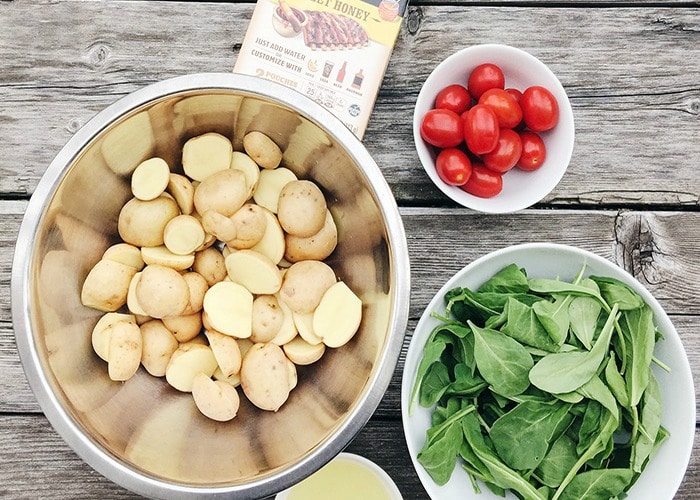 bowls with potatoes, tomatoes and arugula 