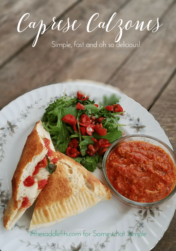 These Caprese Calzones are simple, quick, delicious and made from products that are easy to keep on hand. They are the perfect meal for a warm summer night, or a pretty little appetizer for your next party or get together! via @somewhatsimple