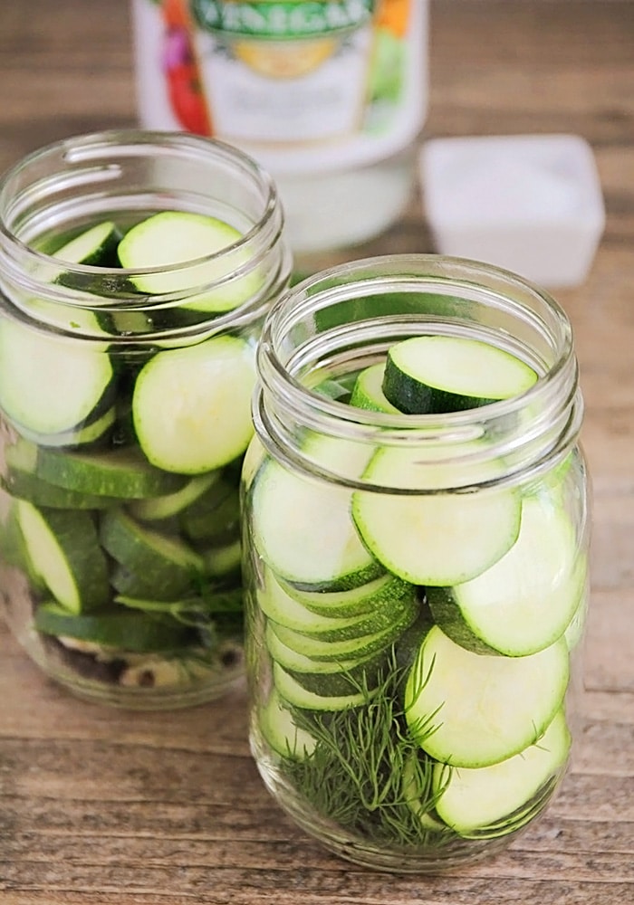 jars filled with zucchini pickles