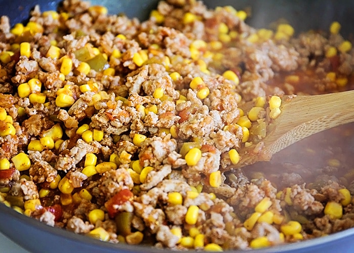 mixing tamale pie ingredients