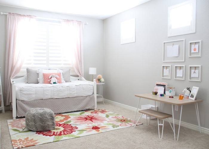 a little girl's bedroom that's been decorated with light pink colors