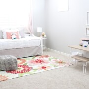 a little girl's bedroom that's been decorated with light pink colors