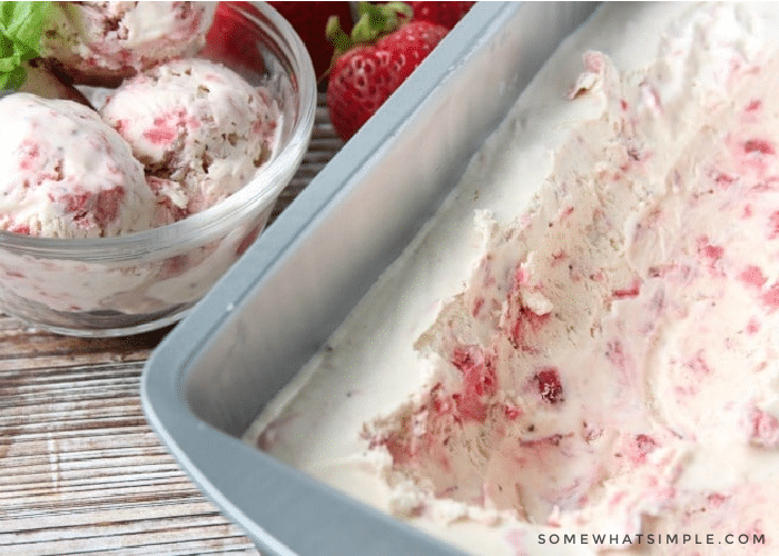 homemade strawberry ice cream in a metal tin