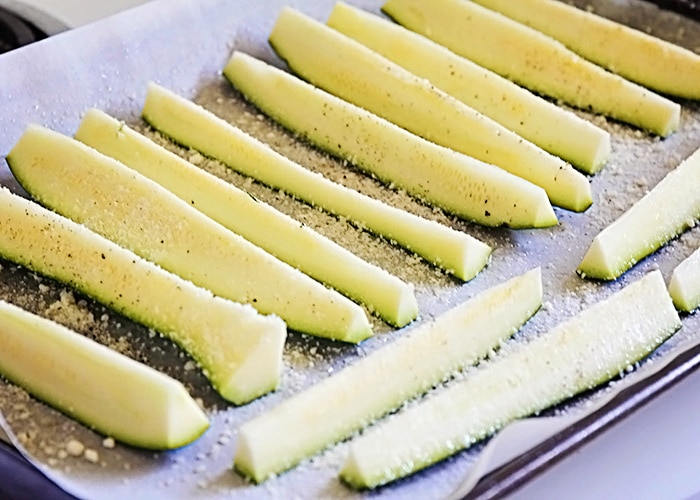 slices of zucchini covered in parmesan cheese