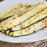 Baked Parmesan Zucchini spears on a plate