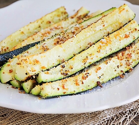 Baked Parmesan Zucchini spears on a plate