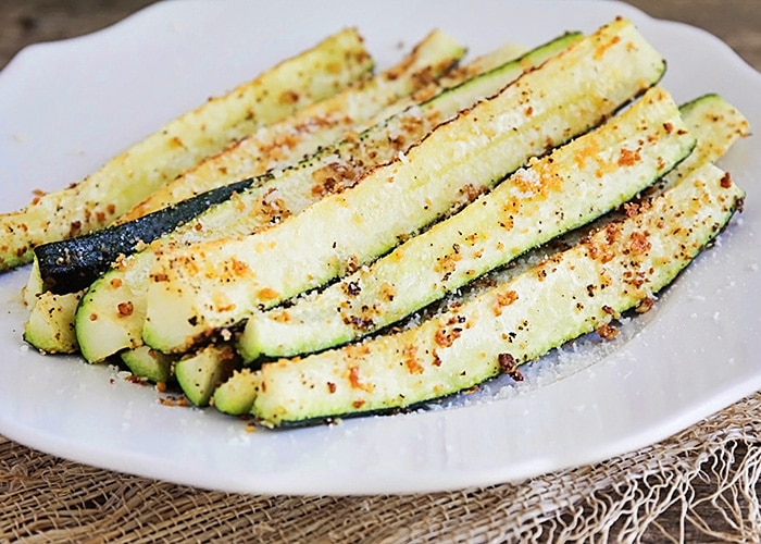 Baked Parmesan Zucchini spears on a plate