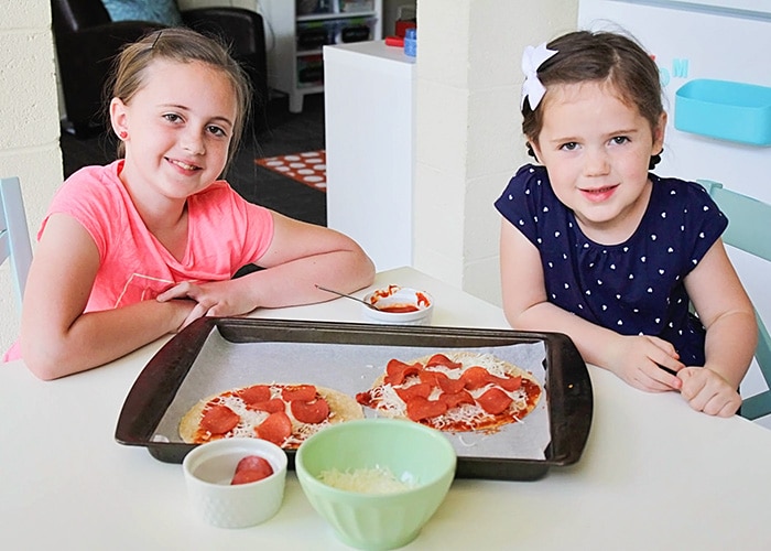 kids making homemade pepperoni tortilla pizza