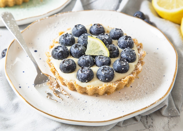 These refreshing, no-bake Lemon and Blueberry Tartlets are packed with citrus goodness and topped with juicy blueberries creating one amazing Summer dessert!