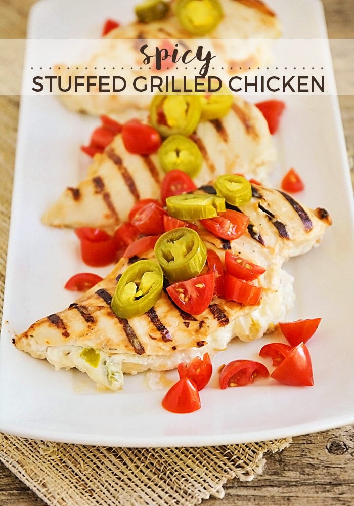 These stuffed grilled chicken breasts are the perfect summer meal! With a little bit of spice and a whole lot of flavor, this recipe is so easy to make on the grill! via @somewhatsimple