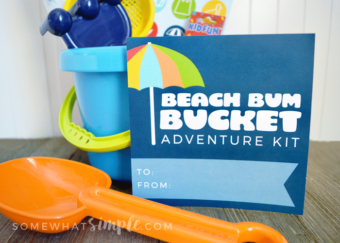 beach bucket filled with activities for kids to do at the beach