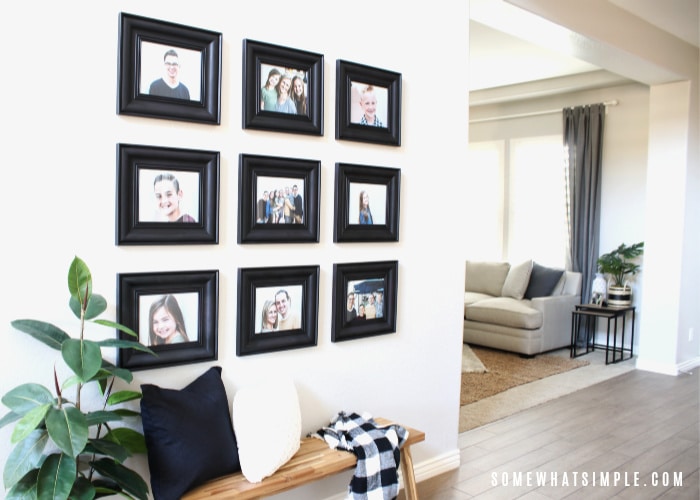 an entry way wall filled with a photo collage
