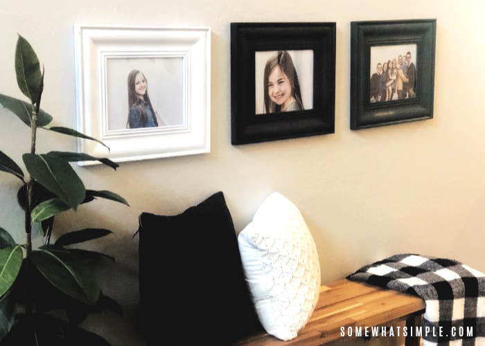 three different colored picture frames on a wall