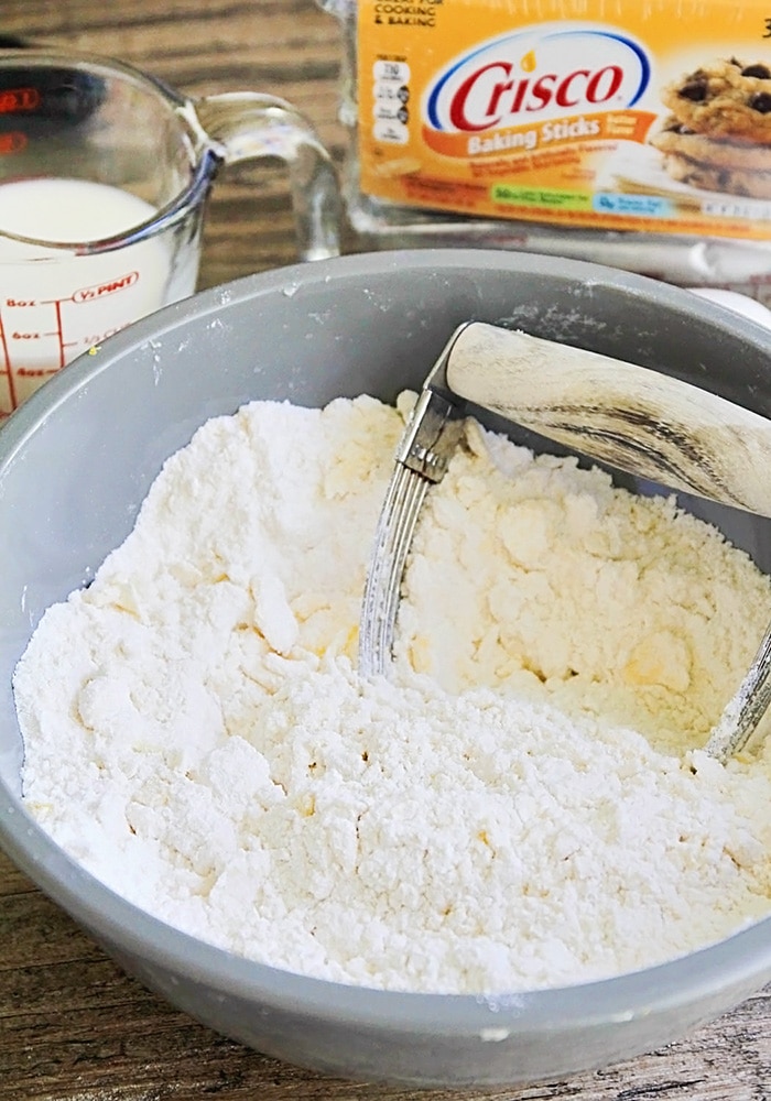 a mixing bowl filled with flour