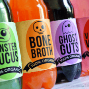 4 soda bottles that are wrapped in Halloween themed drink Labels printable