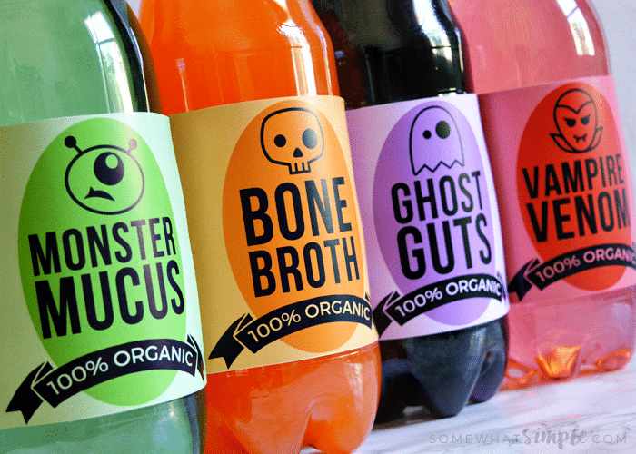 4 soda bottles that are wrapped in Halloween themed drink Labels printable