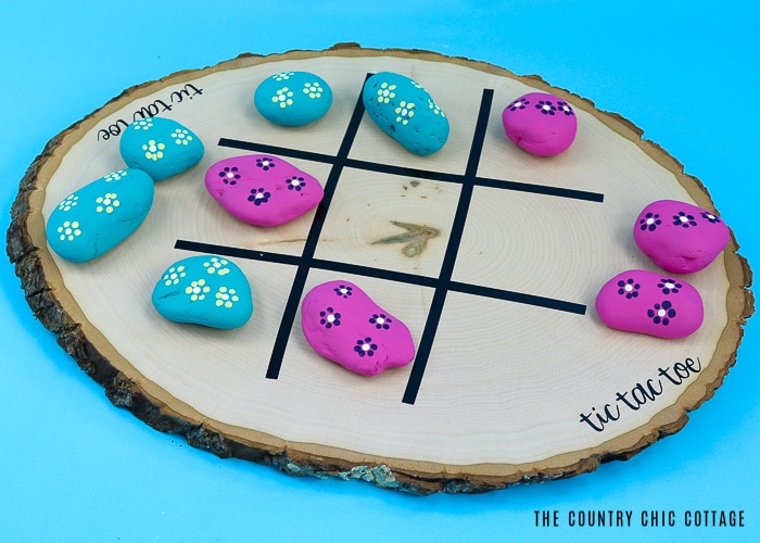 a tic tac toe board using rocks