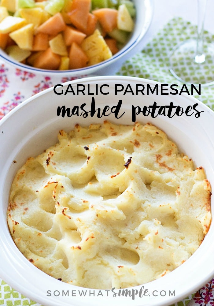 These garlic Parmesan mashed potatoes just might become your go-to mashed potato recipe!  Made with just a few simple ingredients, these homemade potatoes are smooth, bursting with flavor and are a perfect compliment to just about any dinner recipe. #garlicmashedpotatoes #garlicparmesanmashedpotatoesrecipe #easygarlicmashedpotatoes #simplegarlicparmesanmashedpotatoes via @somewhatsimple