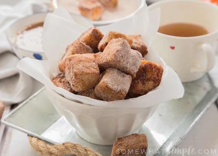 Crisp and sweet French Toast Bites rolled in Apple spice sugar and dunked in apple pie sauce! The perfect Fall treat!