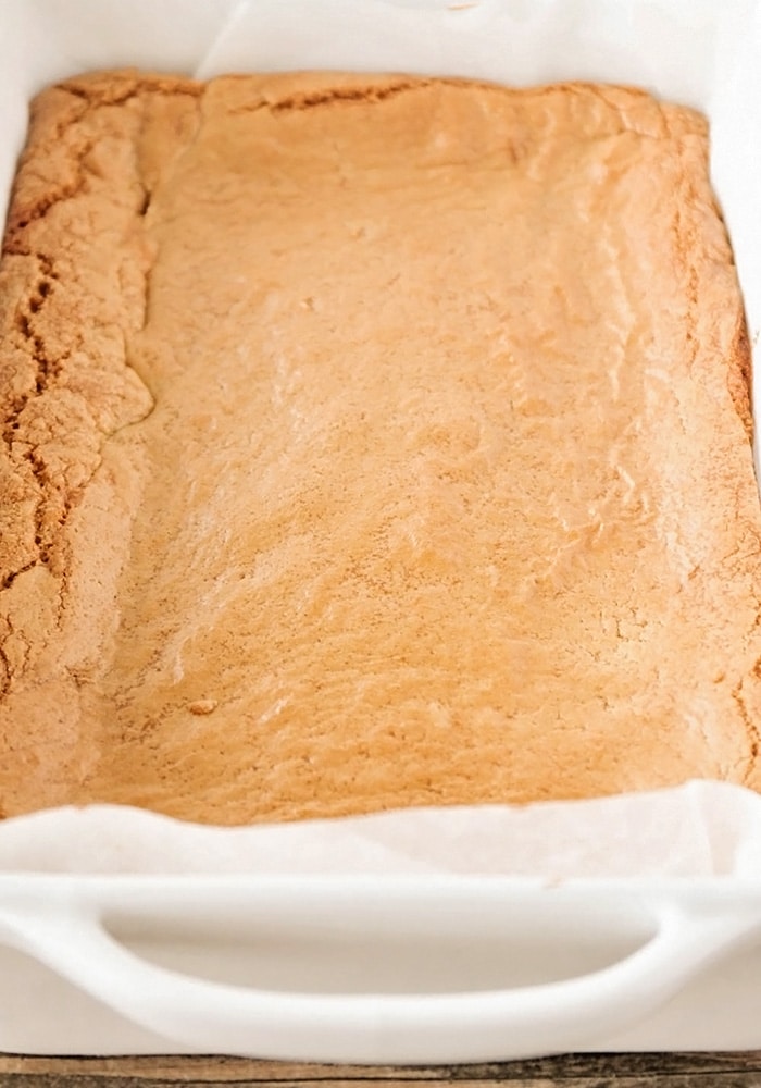 baking pan with Caramel Cheesecake Cookie Bars