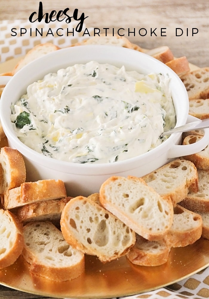 This easy spinach artichoke dip is so cheesy and delicious!  This dip is a savory treat that's perfect for any party. #spinachartichokedip #spinachartichokediprecipe #easyspinachartichokedip #howtomakespinachartichokedip #hotspinachartichokedip via @somewhatsimple