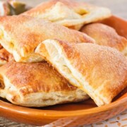 Pumpkin Pie Turnovers on an orange plate