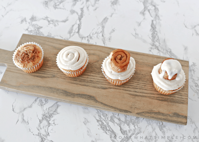 assembly line of cinnamon roll cupcakes