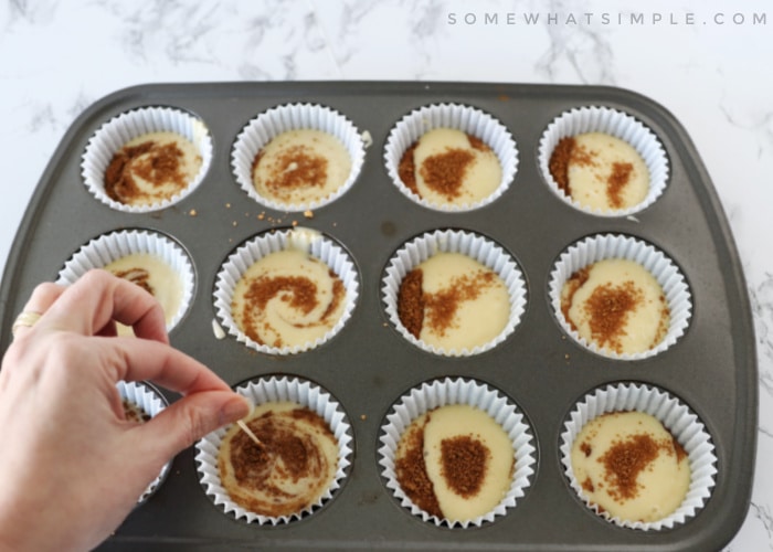 using a toothpick to swirl the batter