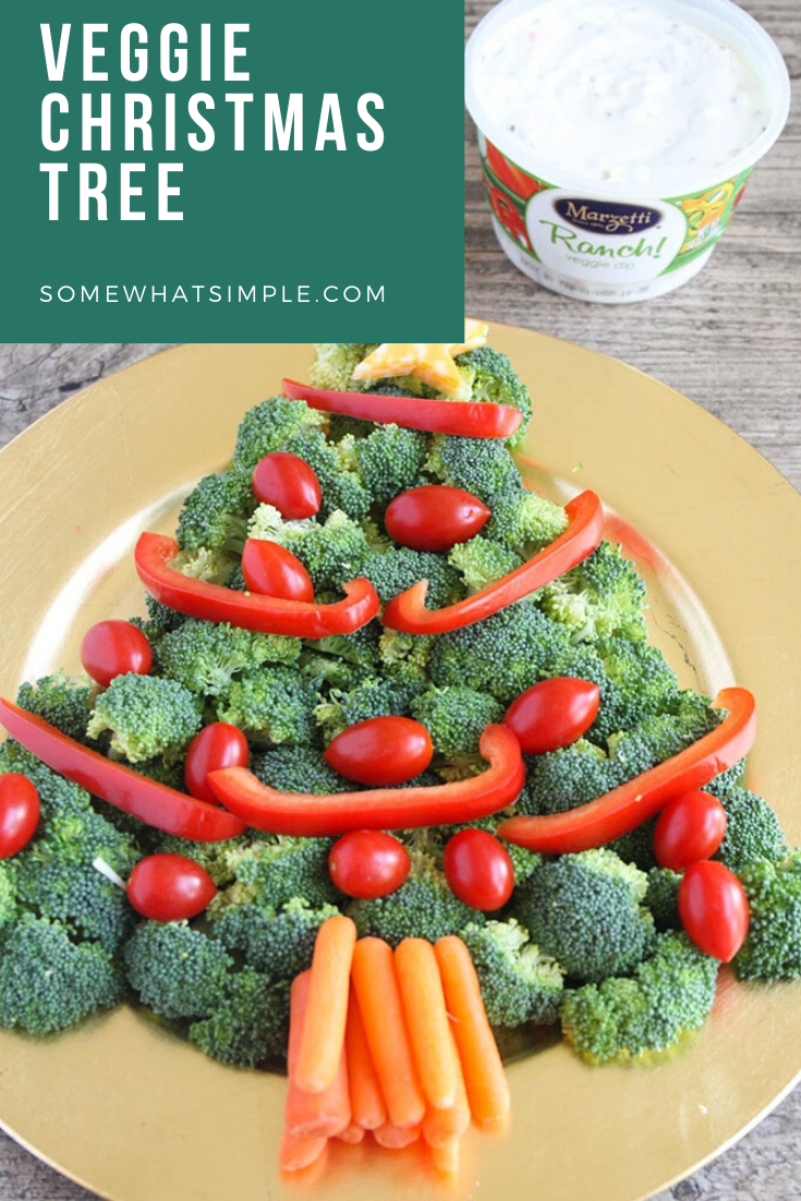 This Christmas tree veggie tray is simple and easy to make. The kids will love helping you arrange the veggies on the tray to make a fun Christmas tree shape that's perfect for the holidays. This veggie tray idea is simple and festive and makes the perfect holiday appetizer. via @somewhatsimple