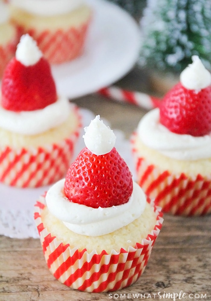 Santa Hat Cupcakes with strawberries and vanilla frosting