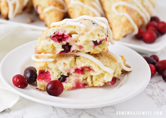 a plate of cranberry scones stacked on top of each other