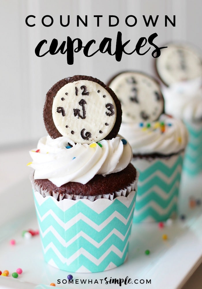 1 New Year's Cupcake in the foreground and two others in the background with a white background