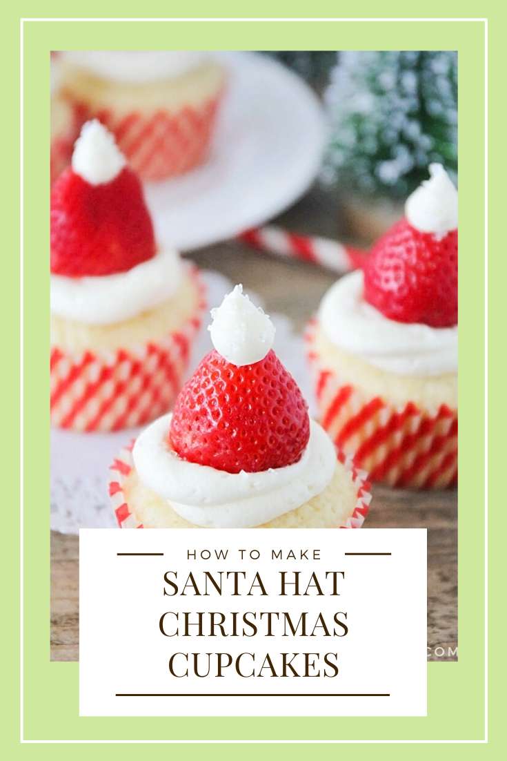 Santa hat cupcakes are a fun and festive dessert to serve during the Christmas holidays.  Topped with a fresh strawberry and homemade frosting, you won't be able to just eat one of these cupcakes. These are the perfect festive dessert idea to serve at your next Christmas party. via @somewhatsimple