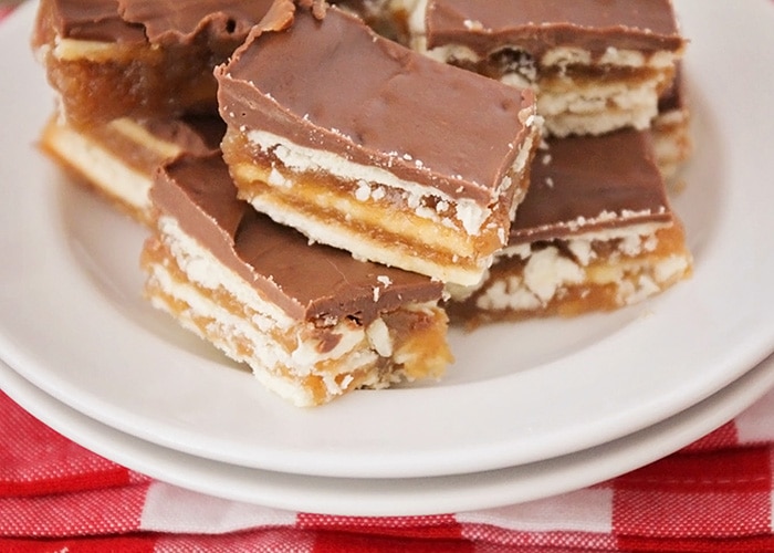 squares of christmas crack toffee on a plate