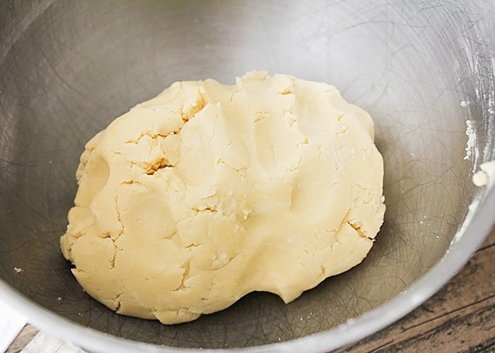 linzer cookie dough in a metal mixing bowl