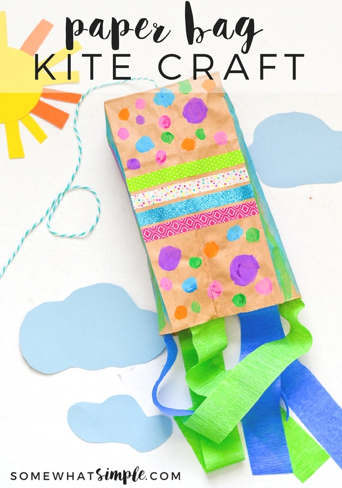 The kids will have so much fun decorating and making their very own paper bag kites - just in time for spring! Made with a brown paper bag and a few simple supplies, they're easy to put together and so much fun to make! #craftsforkids #paperbagkites #papercrafts #howtomakeapaperbagkite #kidscraft via @somewhatsimple