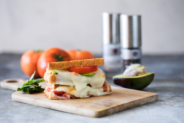 This avocado tomato grilled cheese is the best way to use up all the avocados and tomatoes that are flooding the market. Buttery avocado and gooey cheddar make this sandwich perfect for everyone!