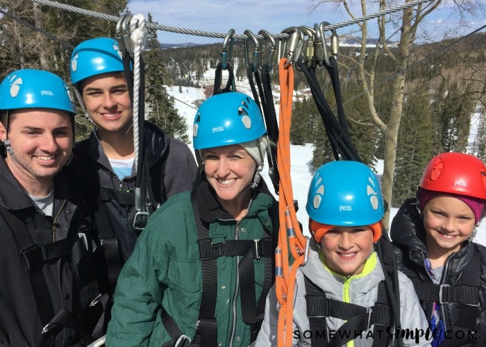 an attractive family getting ready to zipline