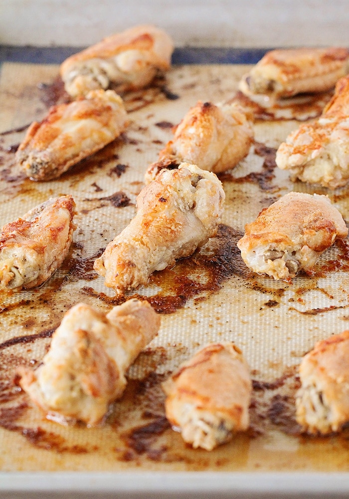 Chicken Wings fresh from the oven on a baking mat