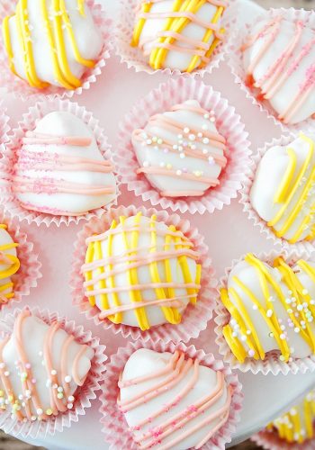 white chocolate and peanut butter truffles drizzled in pastel cholcoates