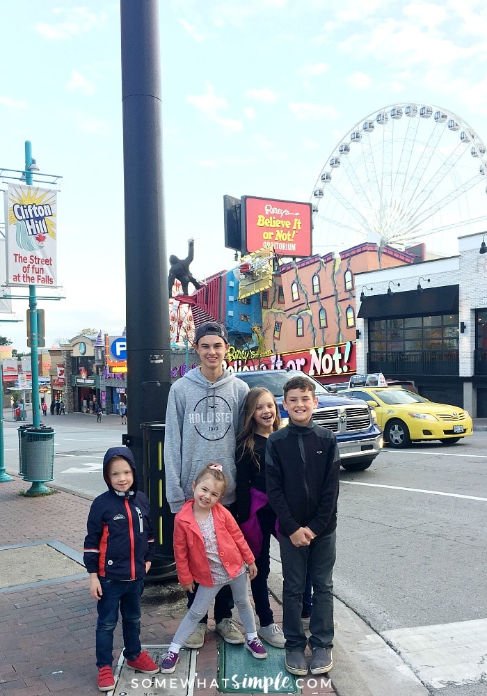 five children standing along the street at the Clifton Hill entertainment district at Niagara Falls, Canada