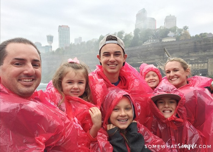 a family in red ponchos riding the Hornblower cruise boat to Niagara Falls