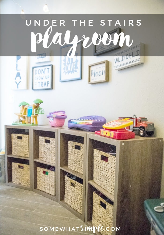 Take a look at how we turned a dark closet into a darling playroom under the stairs! via @somewhatsimple