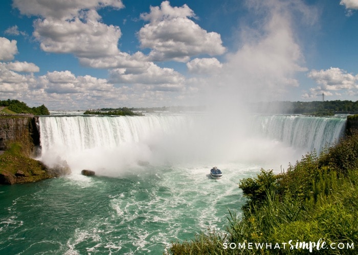 overlooking Niagara Falls from the Canadian side with a boat close to the falls