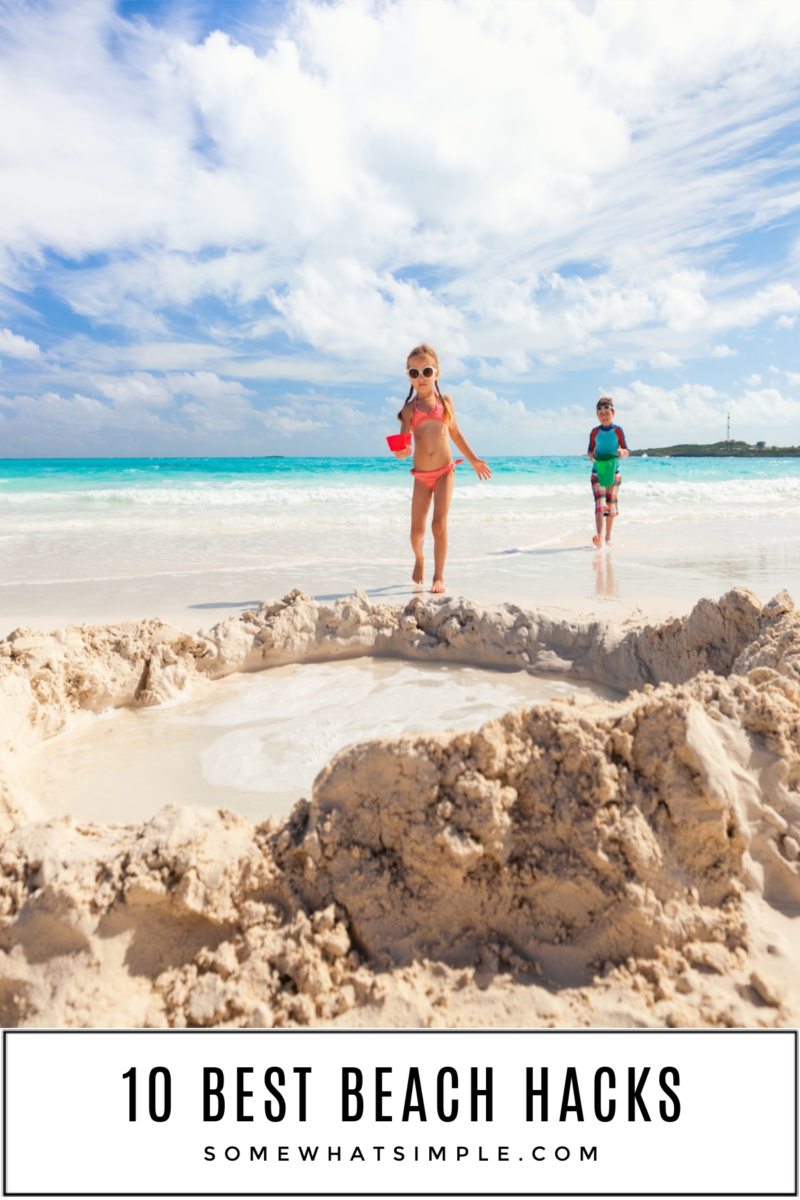 two kids building a sand castle at the beach