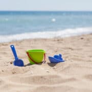 beach toys stuck in the sand