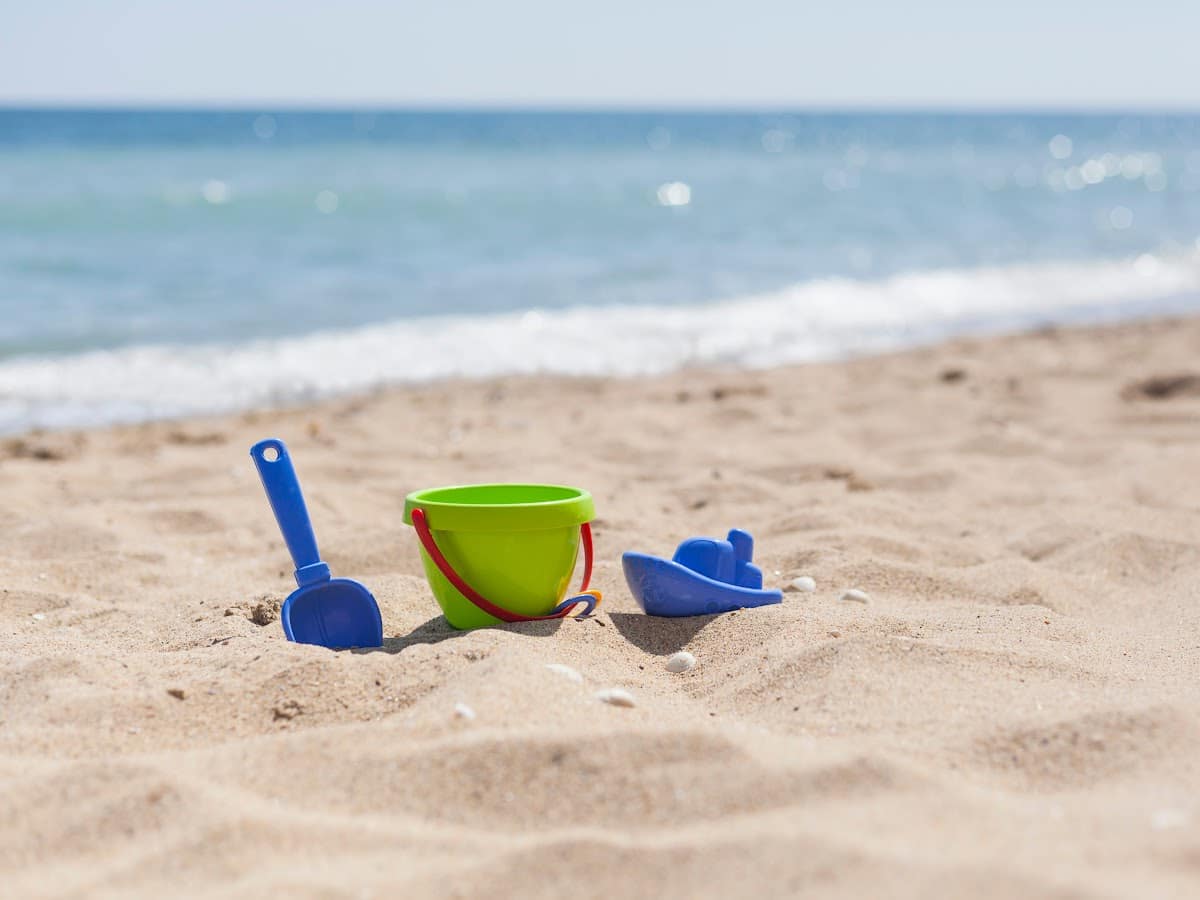 beach toys stuck in the sand