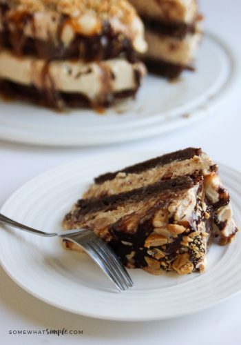 serving a slice of snickers ice cream cake